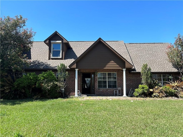 962 Magnolia Ridge Rd, Boutte, LA 70039 - craftsman inspired home featuring a front lawn, brick siding, and roof with shingles