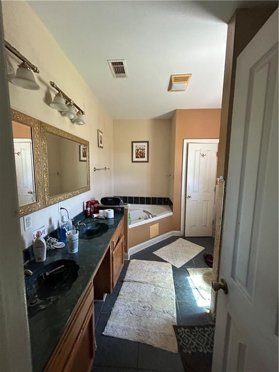 962 Magnolia Ridge Rd, Boutte, LA 70039 - bathroom featuring a sink, a bath, double vanity, and visible vents