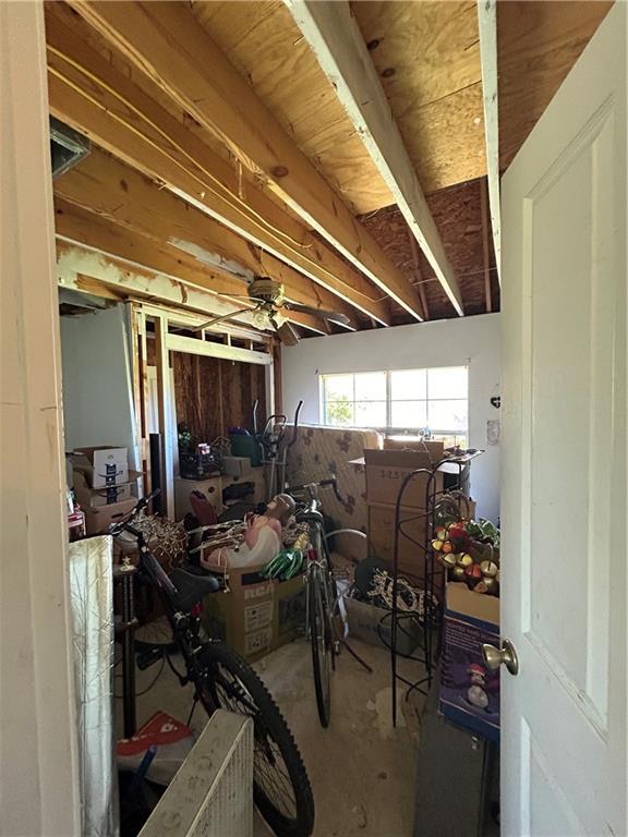 962 Magnolia Ridge Rd, Boutte, LA 70039 - miscellaneous room with ceiling fan and unfinished concrete floors