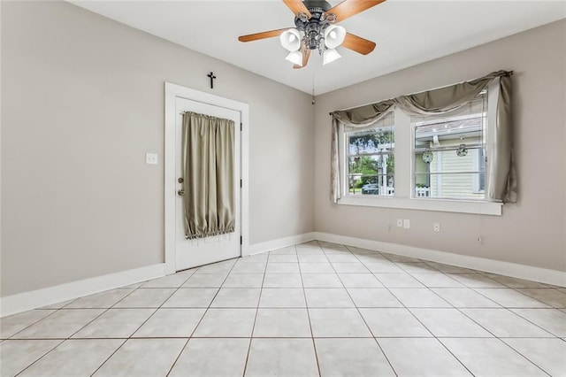 1534 General Collins Ave, New Orleans, LA 70114 - unfurnished room featuring light tile patterned floors, baseboards, and ceiling fan