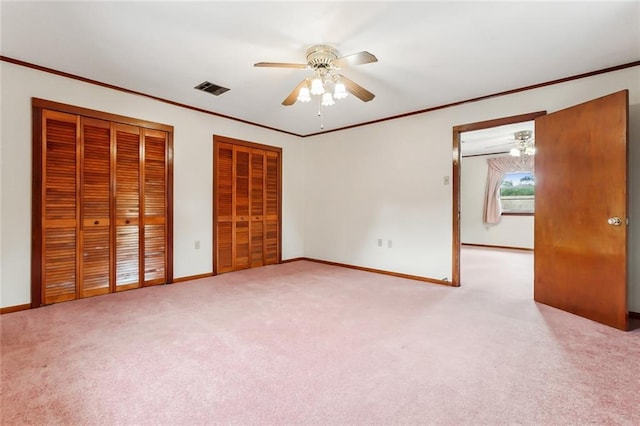 1534 General Collins Ave, New Orleans, LA 70114 - unfurnished bedroom with visible vents, multiple closets, carpet, and crown molding
