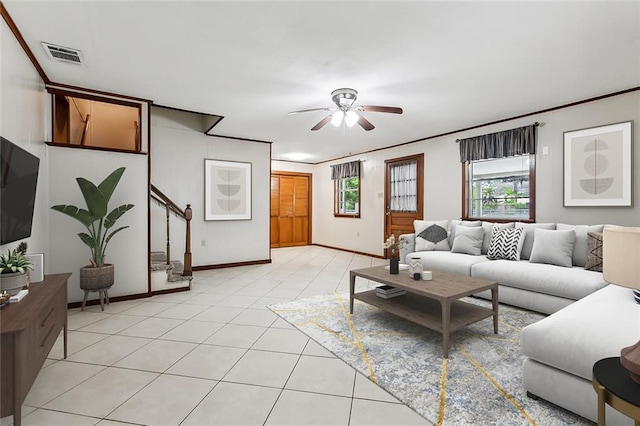 1534 General Collins Ave, New Orleans, LA 70114 - living area with visible vents, stairway, ornamental molding, light tile patterned flooring, and a ceiling fan