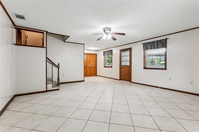 1534 General Collins Ave, New Orleans, LA 70114 - empty room featuring visible vents, crown molding, baseboards, ceiling fan, and stairs