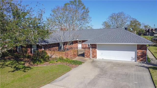 6 Country Club Dr, La Place, LA 70068 - ranch-style home with a front yard, driveway, an attached garage, a shingled roof, and brick siding