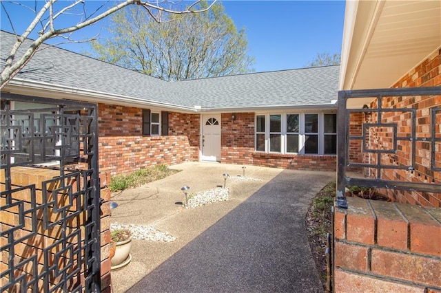 6 Country Club Dr, La Place, LA 70068 - exterior space with brick siding and roof with shingles