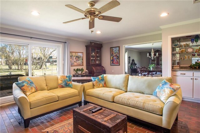6 Country Club Dr, La Place, LA 70068 - living area featuring recessed lighting, brick floor, crown molding, and ceiling fan with notable chandelier