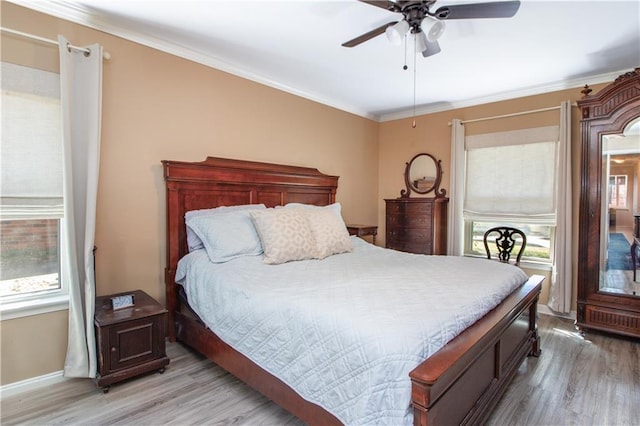 6 Country Club Dr, La Place, LA 70068 - bedroom featuring crown molding, light wood-style floors, baseboards, and ceiling fan
