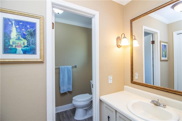 6 Country Club Dr, La Place, LA 70068 - bathroom with vanity, toilet, wood finished floors, and ornamental molding