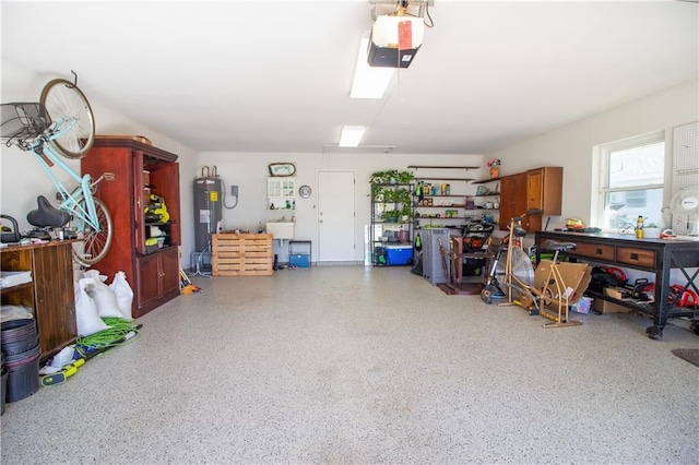 6 Country Club Dr, La Place, LA 70068 - garage with a sink, a workshop area, a garage door opener, and electric water heater