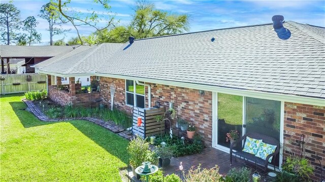 6 Country Club Dr, La Place, LA 70068 - exterior space with brick siding, a lawn, a patio, and roof with shingles