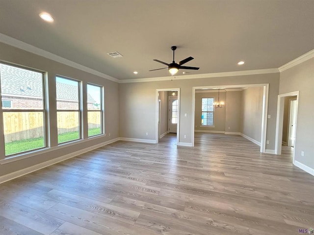 25307 Angele Dr, Ponchatoula, LA 70454 - unfurnished room with ornamental molding, light wood-style flooring, recessed lighting, ceiling fan, and a chandelier