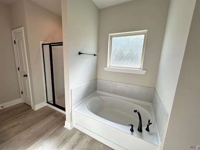 25307 Angele Dr, Ponchatoula, LA 70454 - full bath with a bath, a shower stall, and wood finished floors