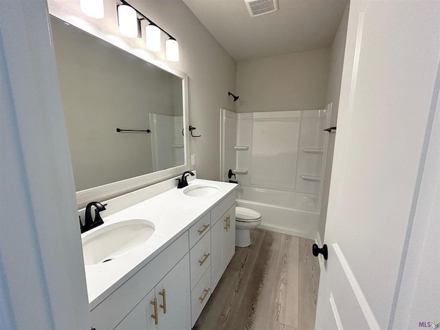 25307 Angele Dr, Ponchatoula, LA 70454 - full bath with wood finished floors, double vanity, and shower / bath combination
