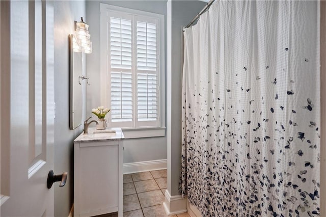 full bathroom with vanity, tile patterned floors, baseboards, and a shower with shower curtain