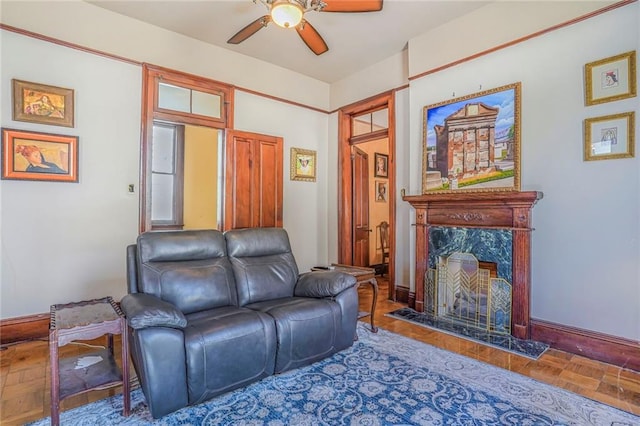 608 Elmira Ave, New Orleans, LA 70114 - living area featuring baseboards, a high end fireplace, and a ceiling fan