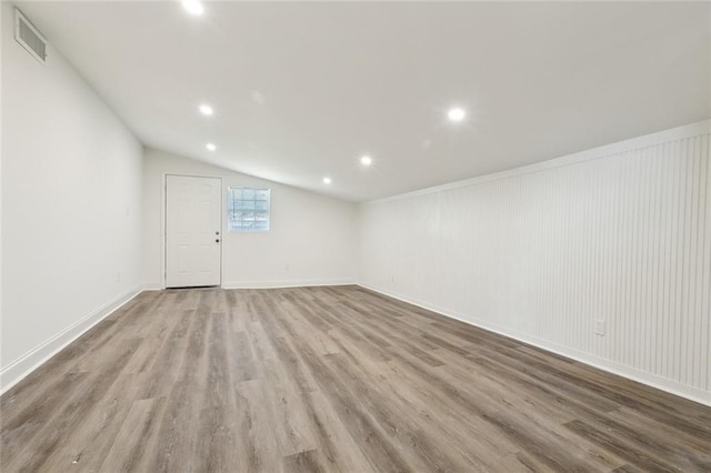 423 Bruce Ave, Terrytown, LA 70056 - unfurnished room featuring recessed lighting, visible vents, wood finished floors, and vaulted ceiling