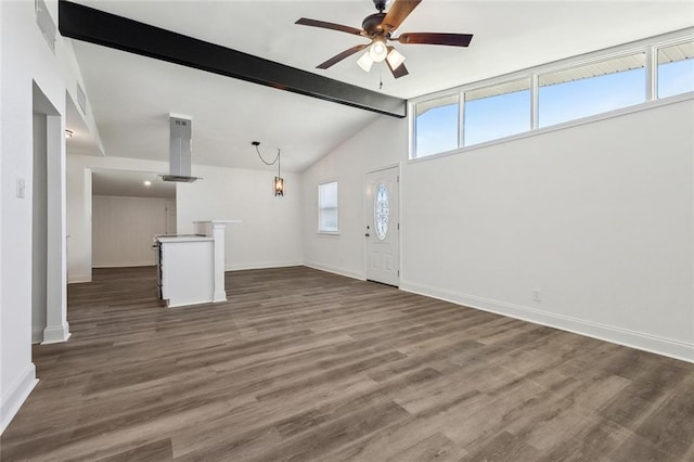 423 Bruce Ave, Terrytown, LA 70056 - unfurnished living room with dark wood finished floors, lofted ceiling with beams, a ceiling fan, and baseboards