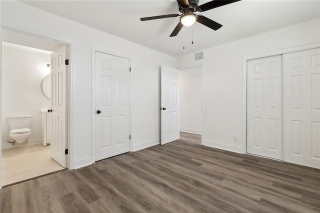 423 Bruce Ave, Terrytown, LA 70056 - unfurnished bedroom with visible vents, ensuite bath, baseboards, and wood finished floors