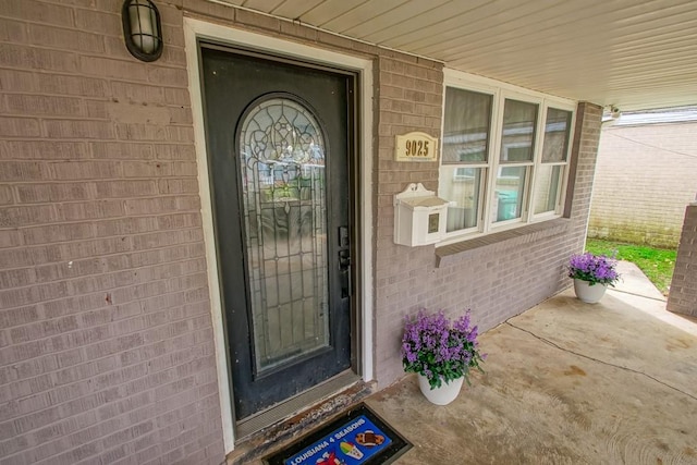 9025 Camille Ct, River Ridge, LA 70123 - view of exterior entry with covered porch and brick siding