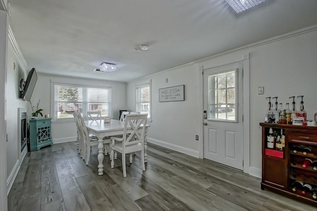 9025 Camille Ct, River Ridge, LA 70123 - dining area with baseboards, wood finished floors, and ornamental molding