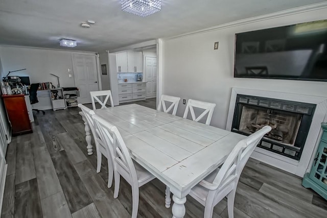 9025 Camille Ct, River Ridge, LA 70123 - dining space with dark wood-style flooring and a fireplace