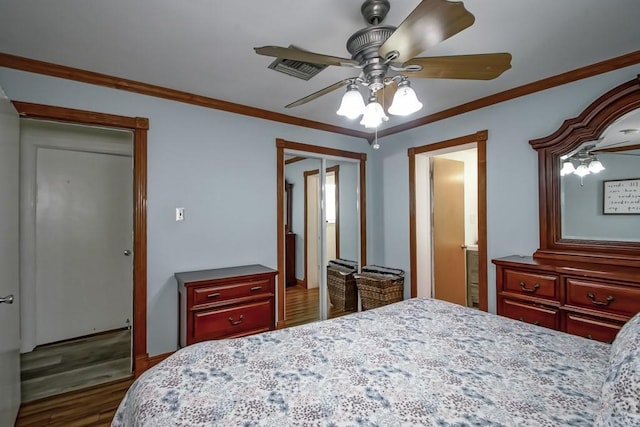 9025 Camille Ct, River Ridge, LA 70123 - bedroom featuring visible vents, crown molding, ceiling fan, and wood finished floors