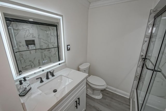 9025 Camille Ct, River Ridge, LA 70123 - bathroom featuring a marble finish shower, toilet, vanity, and wood finished floors