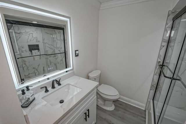 9025 Camille Ct, River Ridge, LA 70123 - bathroom featuring vanity, a marble finish shower, and wood finished floors