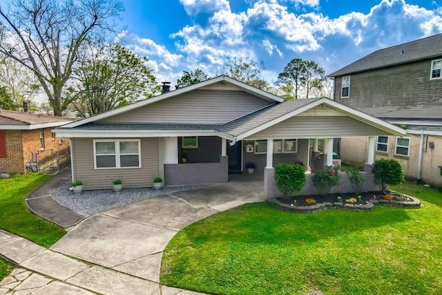 9025 Camille Ct, River Ridge, LA 70123 - ranch-style home with a shingled roof, covered porch, and a front yard