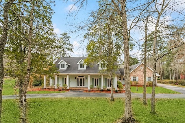 30310 Saint John Dr, Lacombe, LA 70445 - view of front facade with driveway, a porch, and a front yard