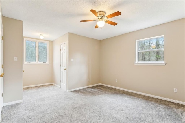 30310 Saint John Dr, Lacombe, LA 70445 - unfurnished room featuring carpet flooring, a ceiling fan, and baseboards