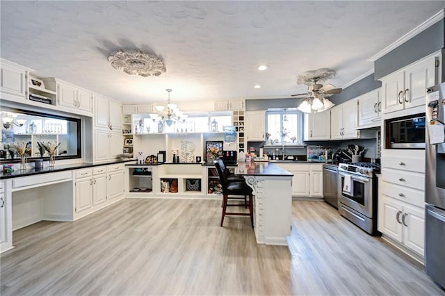 1901 N Turnbull Dr, Metairie, LA 70001 - kitchen featuring open shelves, stainless steel appliances, dark countertops, a chandelier, and crown molding