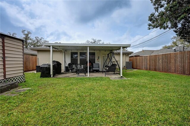 1901 N Turnbull Dr, Metairie, LA 70001 - rear view of house featuring a patio area and a fenced backyard