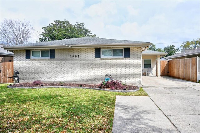 1901 N Turnbull Dr, Metairie, LA 70001 - view of front of home with brick siding and driveway