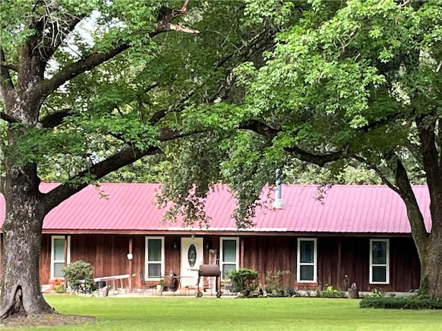 7241 Line Rd, Ethel, LA 70730 - ranch-style house with a porch, metal roof, and a front yard
