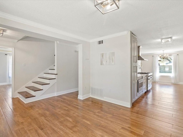 1840 Carol Sue Ave, Terrytown, LA 70056 - interior space with a notable chandelier, visible vents, stairs, and light wood-type flooring