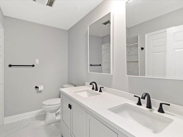 1840 Carol Sue Ave, Terrytown, LA 70056 - bathroom with a sink, baseboards, toilet, and marble finish floor