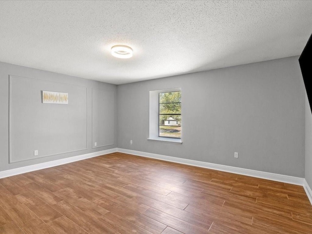 1840 Carol Sue Ave, Terrytown, LA 70056 - unfurnished room with wood finished floors, baseboards, and a textured ceiling