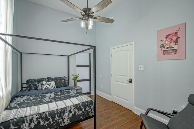 326 N Tonti St, New Orleans, LA 70119 - bedroom with wood finished floors, a high ceiling, and ceiling fan