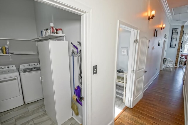 326 N Tonti St, New Orleans, LA 70119 - laundry room with washing machine and clothes dryer, crown molding, attic access, and light wood-style flooring
