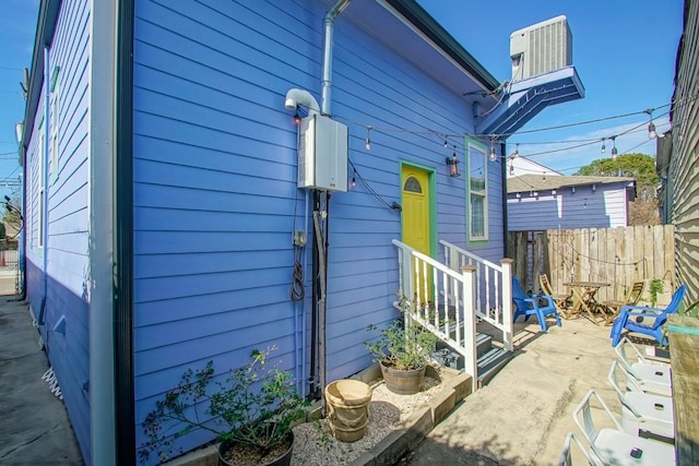 326 N Tonti St, New Orleans, LA 70119 - view of side of property featuring a central air condition unit and a patio