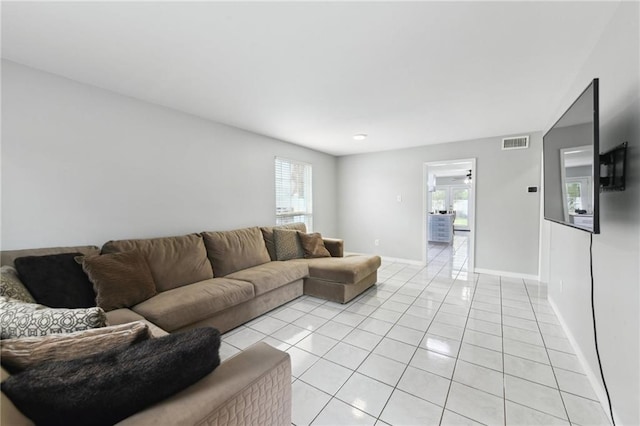 372931 Lilac Ln, Metairie, LA 70001 - living area featuring light tile patterned floors, baseboards, and visible vents