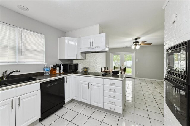 372931 Lilac Ln, Metairie, LA 70001 - kitchen with a sink, ceiling fan, under cabinet range hood, black appliances, and light tile patterned flooring