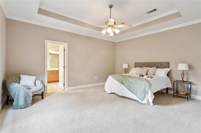 112 Landings Blvd, Slidell, LA 70461 - bedroom with a tray ceiling, crown molding, light carpet, baseboards, and ensuite bathroom