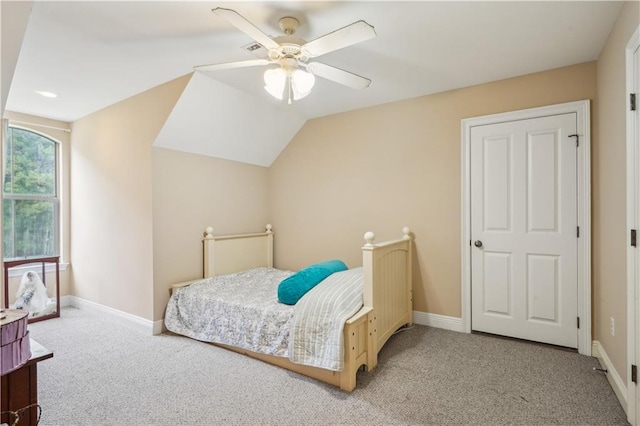 bedroom featuring lofted ceiling, carpet flooring, a ceiling fan, and baseboards