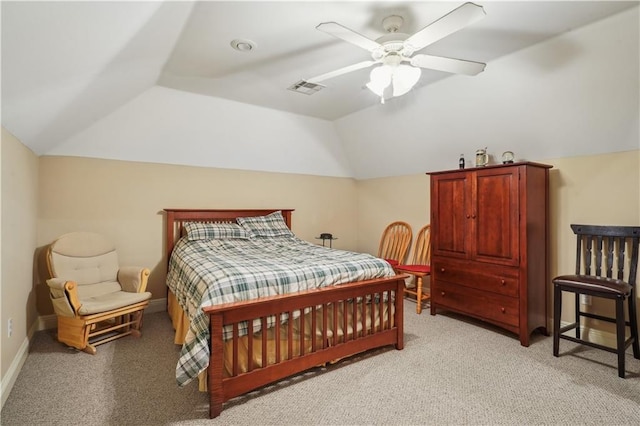 bedroom with a ceiling fan, visible vents, baseboards, lofted ceiling, and light colored carpet