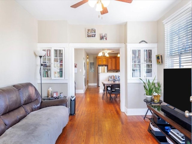 311214 General Taylor St, New Orleans, LA 70125 - living area featuring a ceiling fan, wood finished floors, and a chandelier
