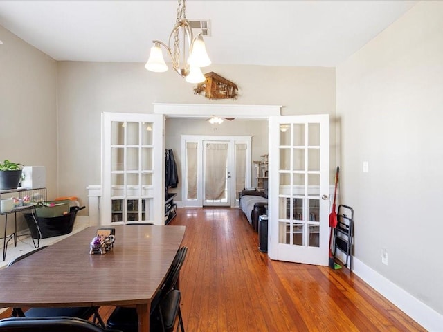 311214 General Taylor St, New Orleans, LA 70125 - dining room with french doors, a chandelier, and hardwood / wood-style flooring