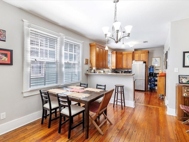 311214 General Taylor St, New Orleans, LA 70125 - dining room with a chandelier and wood-type flooring