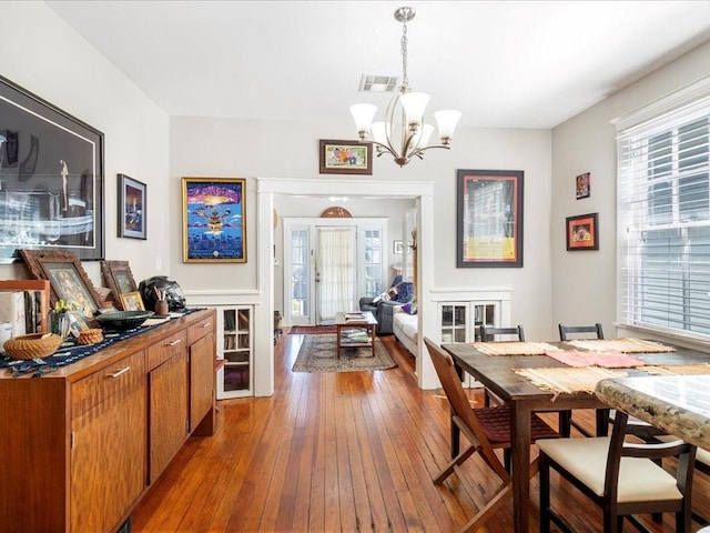311214 General Taylor St, New Orleans, LA 70125 - dining space with hardwood / wood-style floors and a chandelier